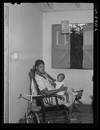 [Untitled photo, possibly related to: Charlotte Amalie, Saint Thomas Island, Virgin Islands. Wife of a defense worker living in the federal housing project]. Sourced from the Library of Congress.