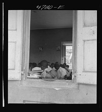 Christiansted, Saint Croix Island, Virgin Islands. At a window of the Christiansted high school. Sourced from the Library of Congress.
