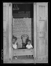 Charlotte Amalie, Saint Thomas Island, Virgin Islands. Children in one of the long row of houses near the waterfront. Sourced from the Library of Congress.