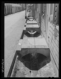 Charlotte Amalie, Saint Thomas Island, Virgin Islands. Open sewer along a street. Sourced from the Library of Congress.