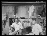 [Untitled photo, possibly related to: Charlotte Amalie, Saint Thomas Island, Virgin Islands. Defense workers employed at the Naval base resting in their living quarters]. Sourced from the Library of Congress.