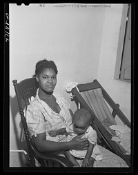 [Untitled photo, possibly related to: Charlotte Amalie, Saint Thomas Island, Virgin Islands. Wife of a defense worker living in the federal housing project]. Sourced from the Library of Congress.