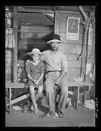 French village, a small settlement on Saint Thomas Island, Virgin Islands. Father and one of his children who live at the French village, a small settlement. Sourced from the Library of Congress.