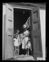 [Untitled photo, possibly related to: Charlotte Amalie, Saint Thomas Island, Virgin Islands. Family living in a slum section near the waterfront]. Sourced from the Library of Congress.