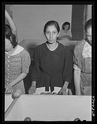 [Untitled photo, possibly related to: Yauco, Puerto Rico. Sorting and packing tomatoes at the Yauco cooperative tomato growers' association]. Sourced from the Library of Congress.