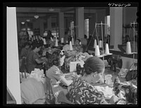 [Untitled photo, possibly related to: Santurce, Puerto Rico. Women working at the Rodriguez needlework factory. Minimum wage is six dollars a week]. Sourced from the Library of Congress.