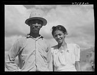 Guanica, Puerto Rico (vicinity). Sugar worker and his wife in the sugar cane fields. Sourced from the Library of Congress.