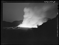 [Untitled photo, possibly related to: Guanica, Puerto Rico (vicinity). Burning a sugar cane field. This is a process that destroys the leaves and makes the sugar cane easier to harvest]. Sourced from the Library of Congress.