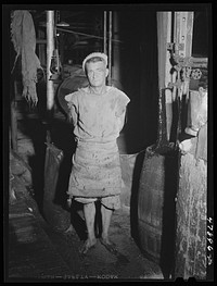 Ensenada, Puerto Rico. A workman in the mill of the South Puerto Rico Sugar Company. Sourced from the Library of Congress.
