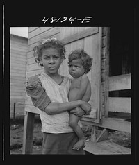 [Untitled photo, possibly related to: San Juan, Puerto Rico. In the huge slum area known as "El Fangitto"]. Sourced from the Library of Congress.