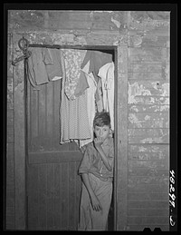 [Untitled photo, possibly related to: Rio Piedras (vicinity), Puerto Rico. Wife and children of a FSA (Farm Security Administration) borrower]. Sourced from the Library of Congress.