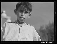 [Untitled photo, possibly related to: San Sebastian, Puerto Rico. Boy who was playing in the street]. Sourced from the Library of Congress.