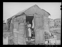 [Untitled photo, possibly related to: San Juan, Puerto Rico. El Fangitto, the slum area]. Sourced from the Library of Congress.