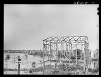 San Juan, Puerto Rico. House being built in El Fangitto, the slum area. Sourced from the Library of Congress.