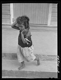 [Untitled photo, possibly related to: Yabucoa, Puerto Rico (vicinity). Wife and some of the children of a farm laborer]. Sourced from the Library of Congress.