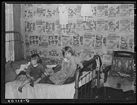 Children in bedroom of their home, Charleston, West Virginia. Their mother has TB. Father works on WPA (Works Progress Administration). See 50129-D. Sourced from the Library of Congress.