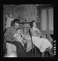 [Untitled photo, possibly related to: Coal miner, his wife and one of their many children. Bertha Hill, West Virginia]. Sourced from the Library of Congress.