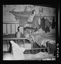 Coal miner's son in bedroom of company house. Pursglove, Scotts Run, West Virginia. Sourced from the Library of Congress.