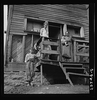 [Untitled photo, possibly related to: Wife of unemployed miner with her mother and two children. Marine, West Virginia]. Sourced from the Library of Congress.