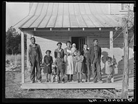  family (rehabilitation clients) on porch of new home they are building near Raleigh, North Carolina. Sourced from the Library of Congress.