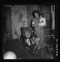 Coal miner's wife and two of their children. Bertha Hill, West Virginia. Sourced from the Library of Congress.