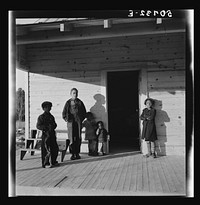 [Untitled photo, possibly related to: Family of rehabilitation client on front porch of new home near Raleigh, North Carolina]. Sourced from the Library of Congress.