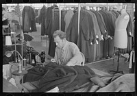 Boris Drasin, president of the workers' Aim Association Inc., works as an operator in the garment factory at a the same wage as the other operators. Hightstown, New Jersey by Russell Lee