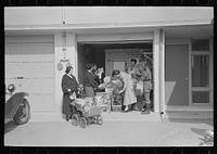 [Untitled photo, possibly related to: Consumer's cooperative. The homesteaders have their own kosher meat shop and grocery, which they expect to enlarge as the colony grows. This picture shows manager, Nathan Dubin, doing a flourishing business in his temporary store. Jersey Homesteads, Hightstown, New Jersey] by Russell Lee