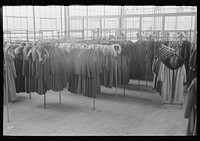 [Untitled photo, possibly related to: Ladies' coats manufactured at the cooperative garment factory, Hightstown, New Jersey] by Russell Lee