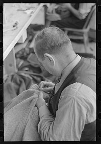[Untitled photo, possibly related to: Closeup of tailor in garment factory, Jersey Homesteads, Hightstown, New Jersey] by Russell Lee