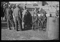 Farmers at country auction near Aledo, Mercer County, Illinois. Note harness by Russell Lee