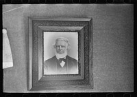 Family portrait in home of Fred Rowe, farmer near Estherville, Iowa by Russell Lee