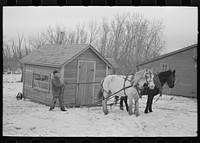 Moving transportable house. Roy Merriot farm near Estherville, Iowa by Russell Lee