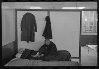 Man examining ankle, homeless men's bureau, Sioux City, Iowa by Russell Lee
