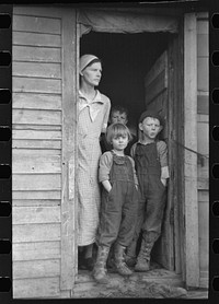 Mrs. Frank Moody with two of her seven children on their eighty acre farm in Miller Township, Woodbury County, Iowa by Russell Lee