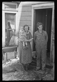 Mr. Rauhauser, wife and one of his seven children, Ruthven, Iowa. He works as a farm hand. At present he is out of work. He has made application for direct relief by Russell Lee