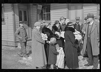 A group of flood refugees on the streets of McLeansboro, Illinois by Russell Lee