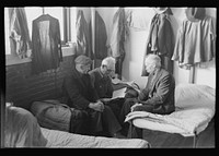 [Untitled photo, possibly related to: Man reading to fellow inmates, homeless men's bureau, Sioux City, Iowa] by Russell Lee