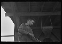 [Untitled photo, possibly related to: Workers at pea vinery talking, near Sun Prairie, Wisconsin] by Russell Lee