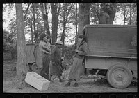 Blueberry pickers getting ready to go into the fields, near Little Fork, Minnesoat by Russell Lee