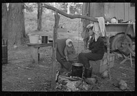 Indian mother and baby, blueberry pickers' camp near Little Fork, Minnesota by Russell Lee