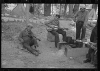 Indian boys playing guitar and violin in blueberry camp near Little Fork, Minnesota by Russell Lee