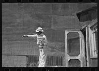 The auctioneer at S.W. Sparlin sale, Orth, Minnesota by Russell Lee