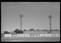 Signs and lighting standards at baseball park, Saint Paul, Minnesota by Russell Lee