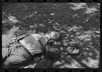 [Untitled photo, possibly related to: Transient laborer asleep in park, Gateway District, Minneapolis, Minnesota] by Russell Lee