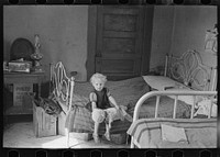 Child of Edwin Gorder in farmhouse bedroom, Williams County, North Dakota by Russell Lee