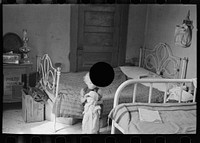 [Untitled photo, possibly related to: Child of Edwin Gorder in farmhouse bedroom, Williams County, North Dakota] by Russell Lee