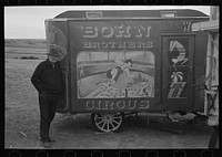 Maker of circus wagons with one of his wagons, Alger [i.e. Archer] Sheridan County, Montana by Russell Lee