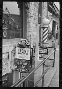 Entrance to beauty parlor and barber shop, Williston, North Dakota by Russell Lee