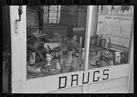 Drugstore window, Ray, North Dakota by Russell Lee